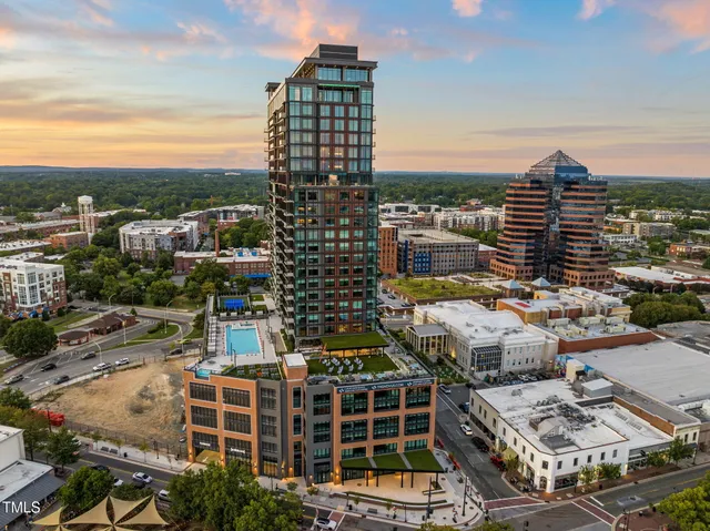 a living room with furniture kitchen and a dining table