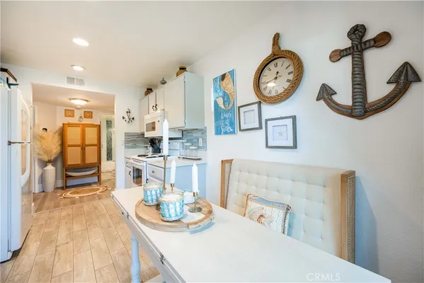 a view of a kitchen with dining table and chairs