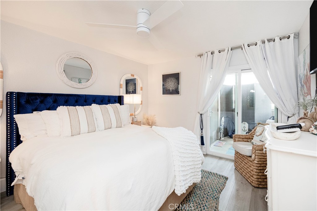 68 Corniche Drive, Unit B Dana Point, CA 92629 - Photo 19 of 35 a bed room with a bed and a window