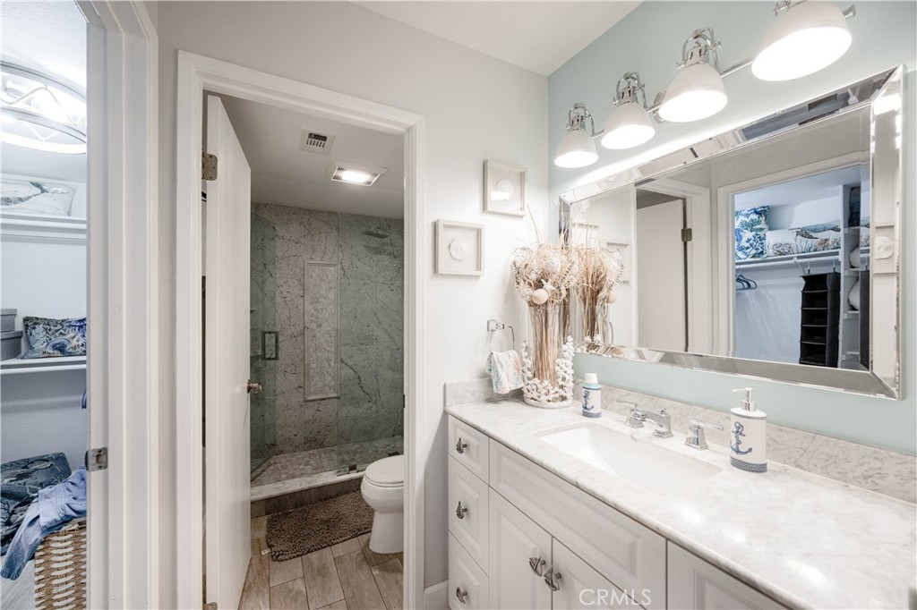 68 Corniche Drive, Unit B Dana Point, CA 92629 - Photo 22 of 35 a bathroom with a sink a toilet and shower