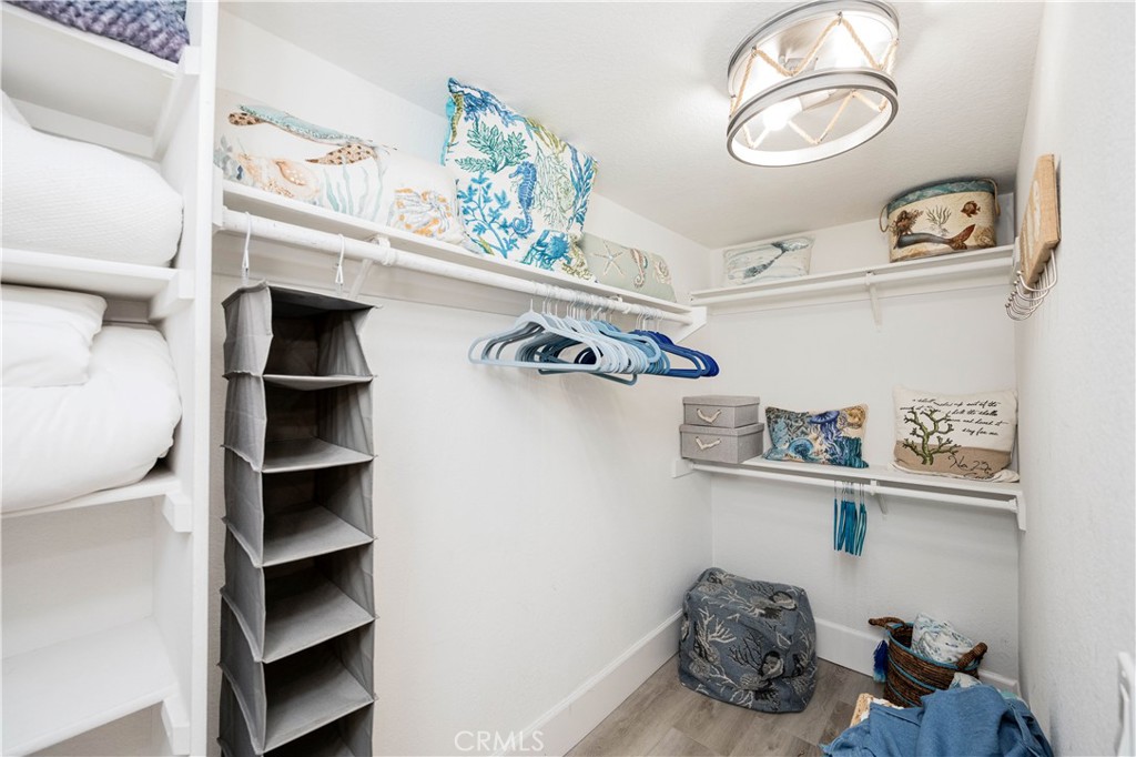 68 Corniche Drive, Unit B Dana Point, CA 92629 - Photo 24 of 35 a view of walk in closet with clothes and shoes