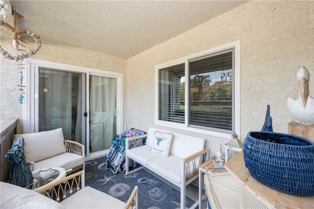 68 Corniche Drive, Unit B Dana Point, CA 92629 - Photo 30 of 35 a living room with furniture and a window