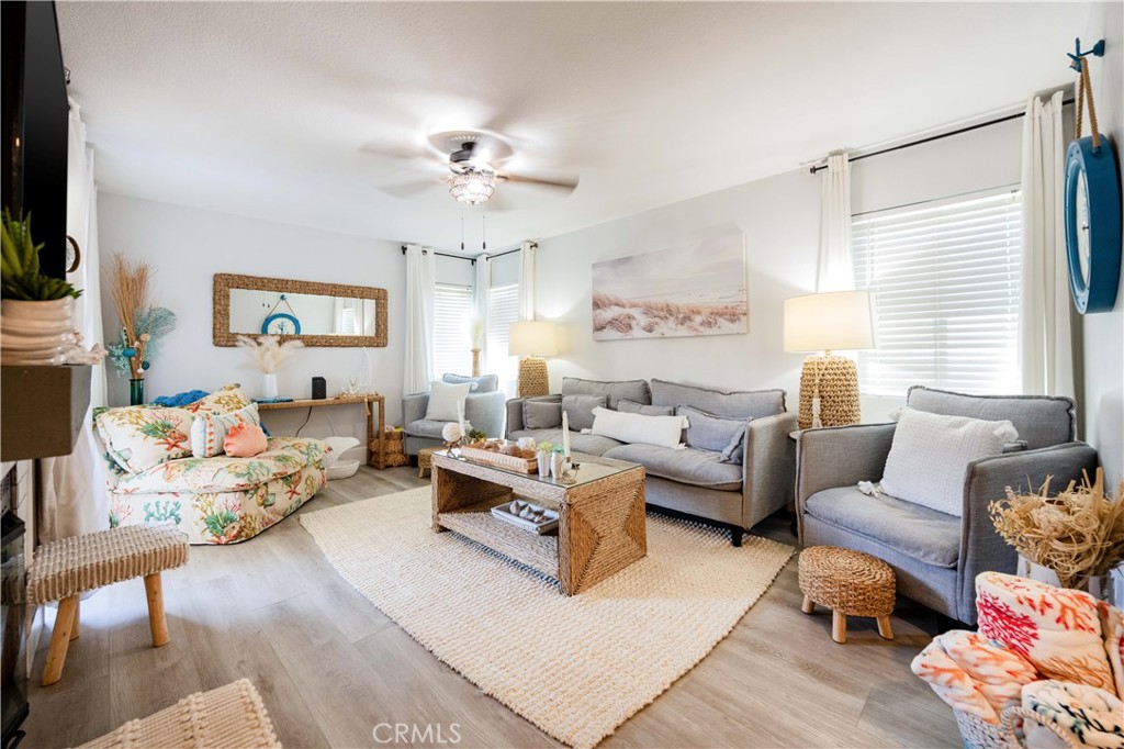 68 Corniche Drive, Unit B Dana Point, CA 92629 - Photo 3 of 35 a living room with furniture and a flat screen tv