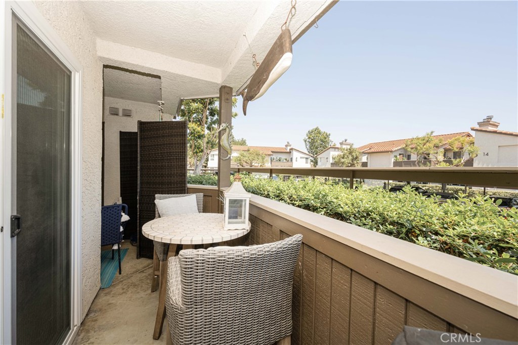 68 Corniche Drive, Unit B Dana Point, CA 92629 - Photo 32 of 35 a dining room with furniture and a floor to ceiling window
