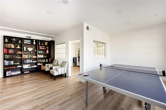 a living room with furniture a rug and a large window