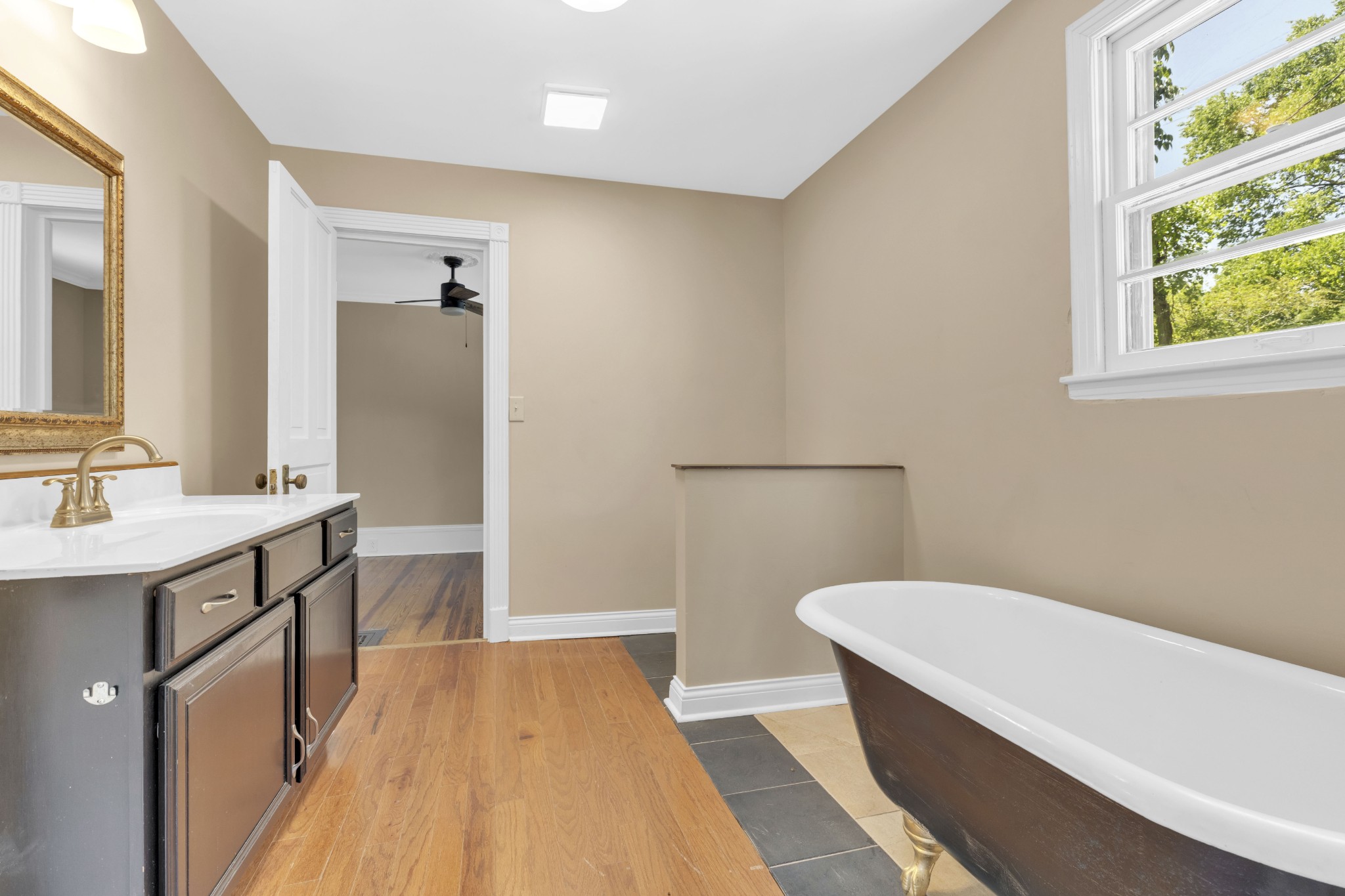 115 North Main Street Springfield, TN 37172 - Photo 8 of 24 a bathroom with a sink and a bathtub