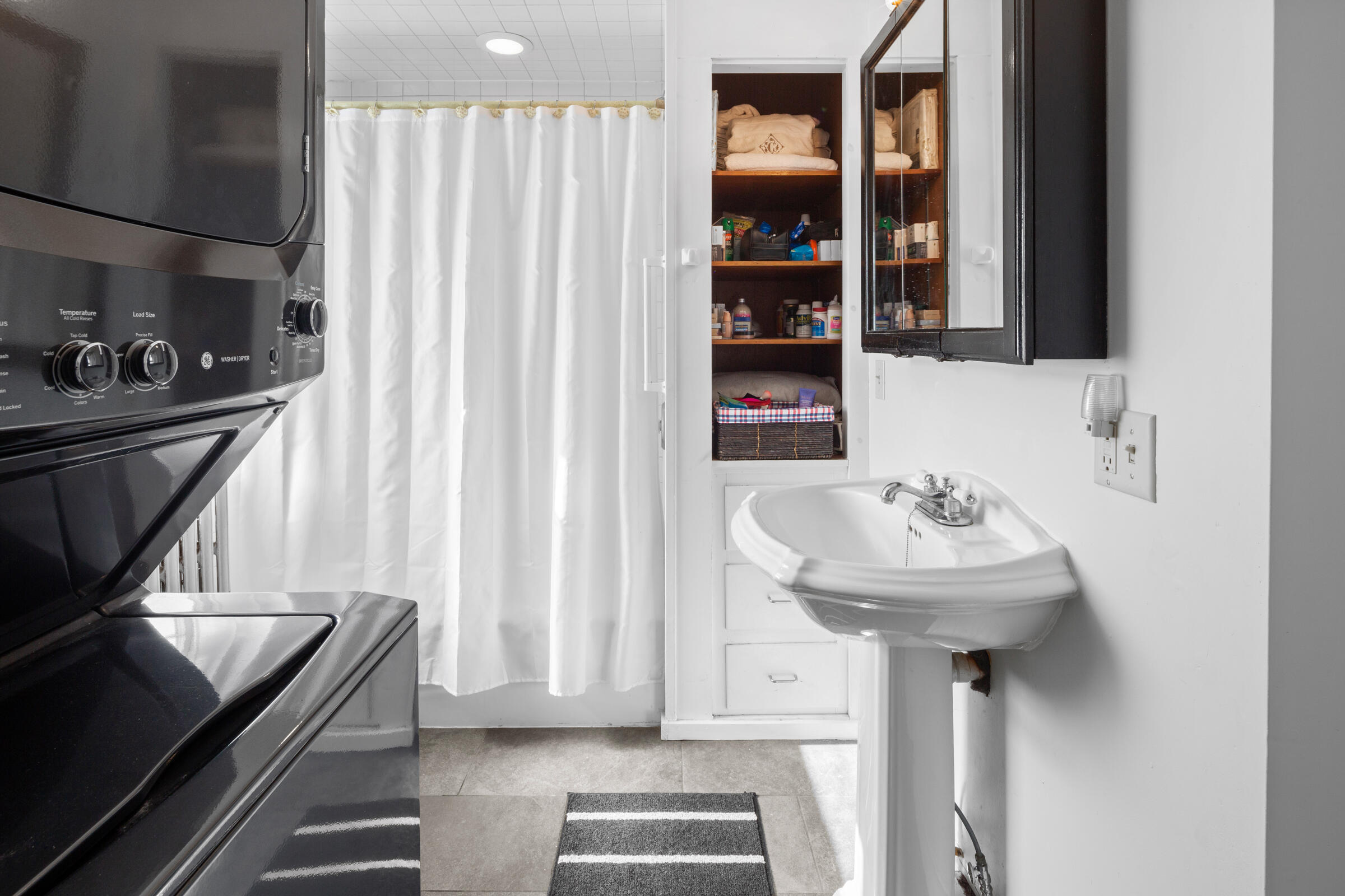 115 Commercial Street, Unit B Wellfleet, MA 02667 - Photo 15 of 37 a bathroom with a sink and a mirror
