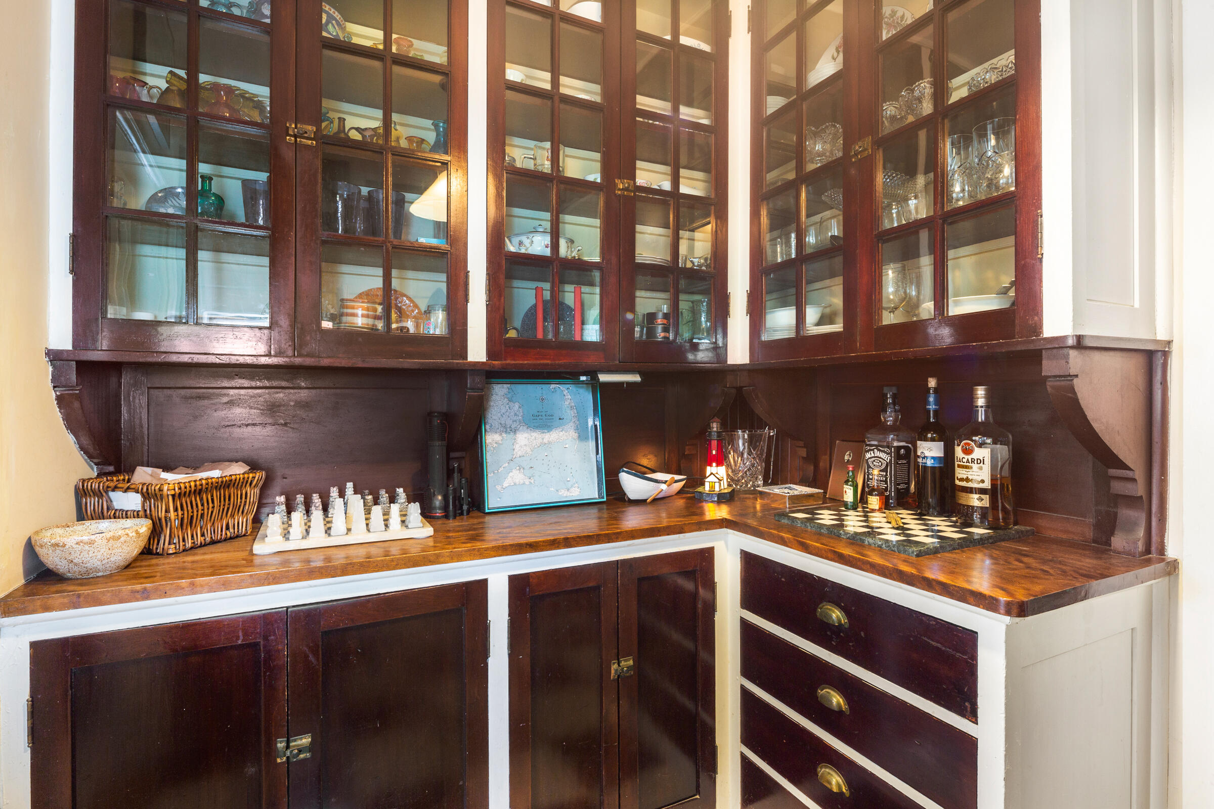 115 Commercial Street, Unit B Wellfleet, MA 02667 - Photo 16 of 37 a kitchen with a sink and cabinets