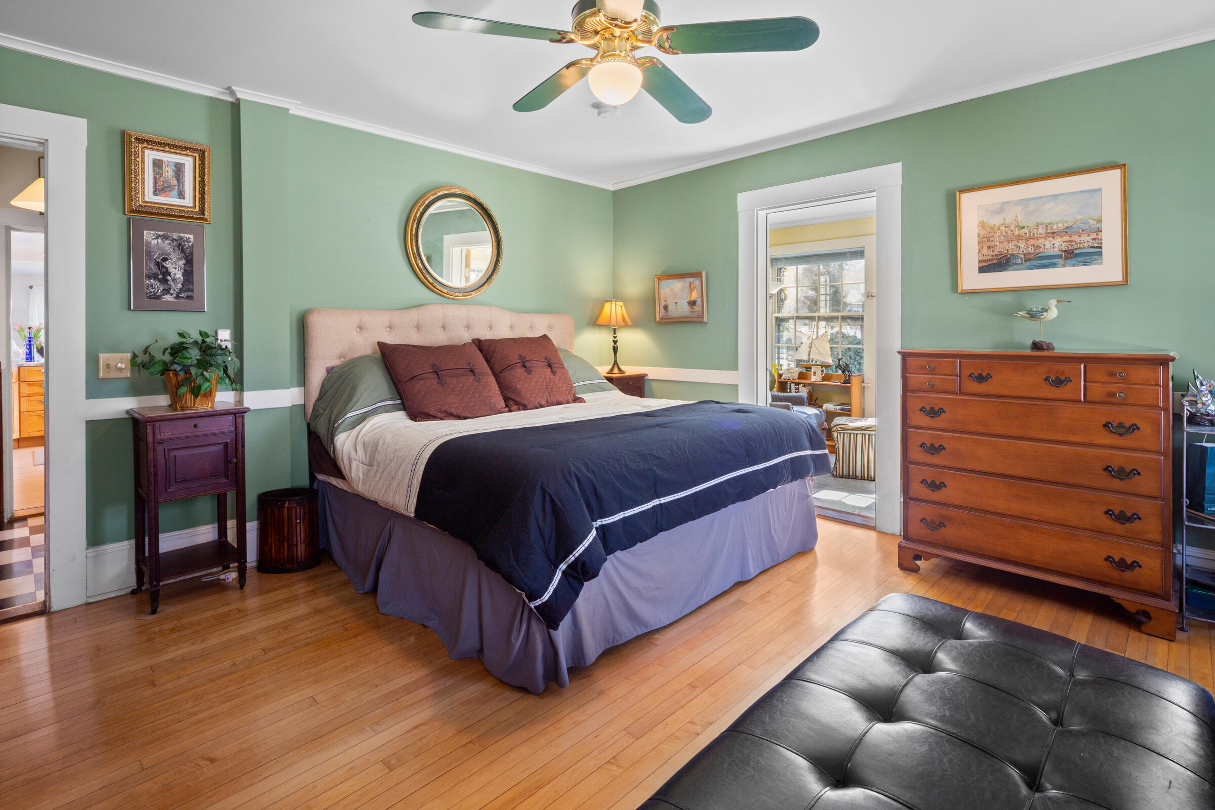 115 Commercial Street, Unit B Wellfleet, MA 02667 - Photo 18 of 37 a bed room with a bed and painting on the wall