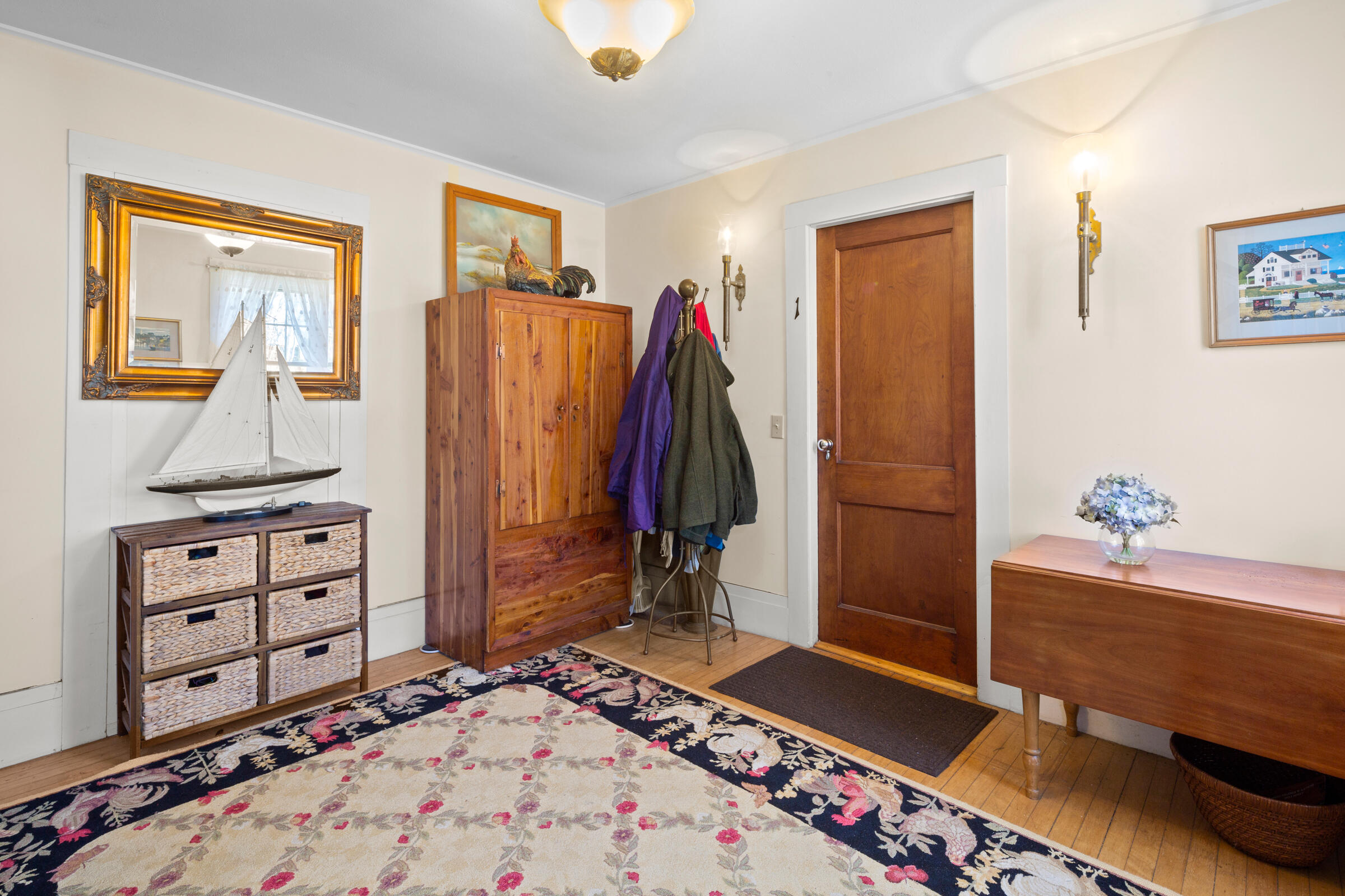 115 Commercial Street, Unit B Wellfleet, MA 02667 - Photo 21 of 37 a view of a bedroom with baby crib and bedroom