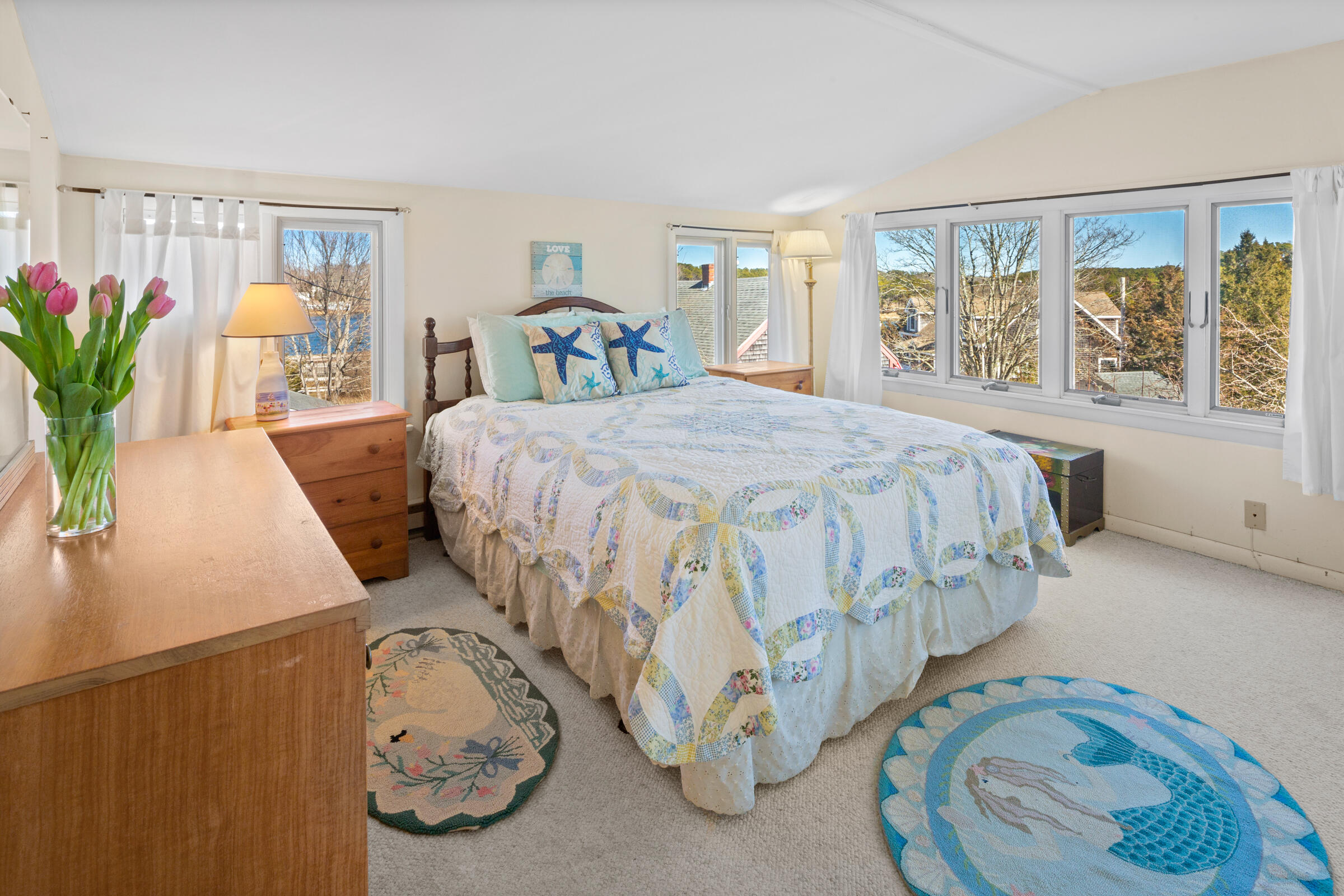 115 Commercial Street, Unit B Wellfleet, MA 02667 - Photo 23 of 37 a bedroom with a bed and window