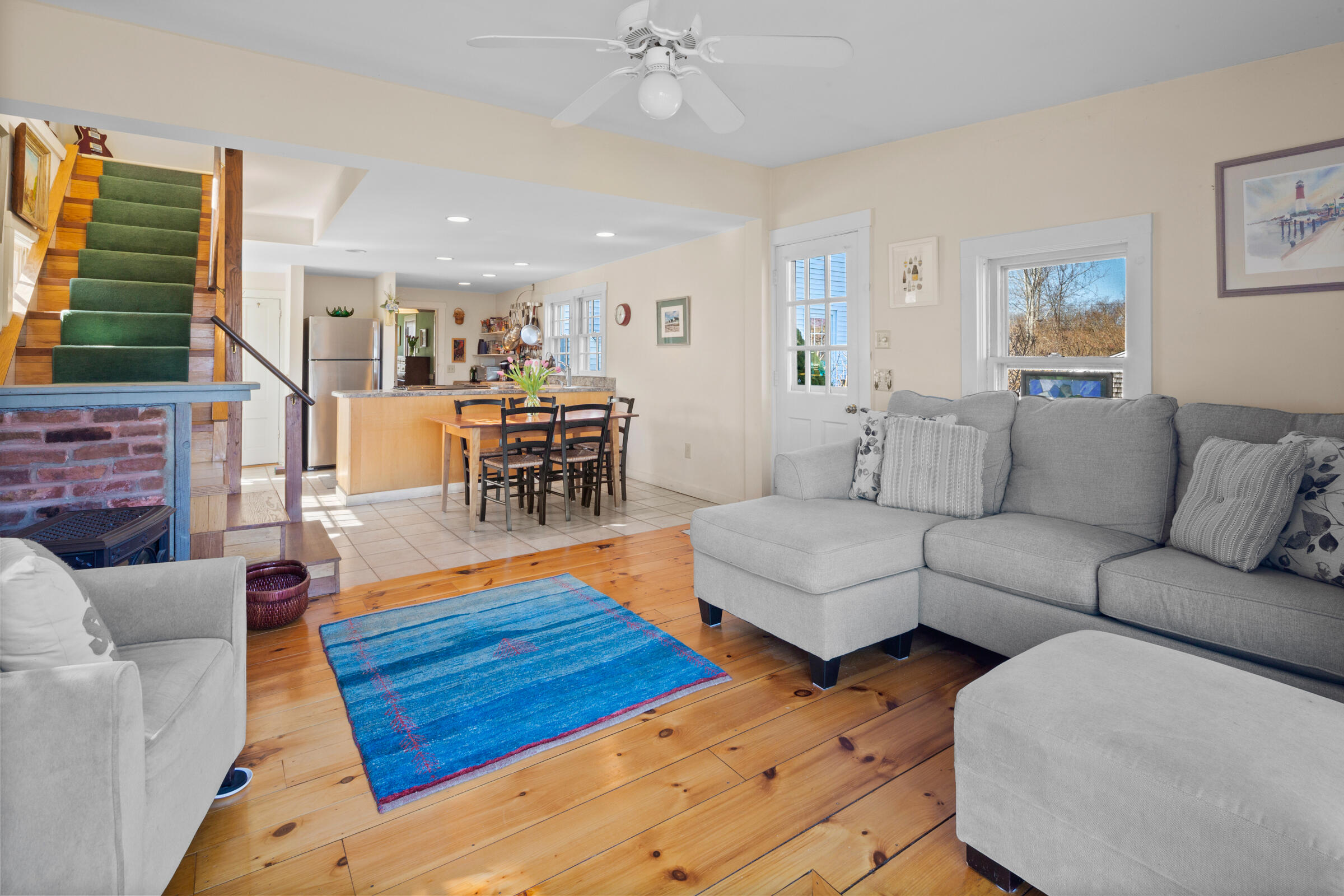115 Commercial Street, Unit B Wellfleet, MA 02667 - Photo 8 of 37 a living room with furniture and a wooden floor