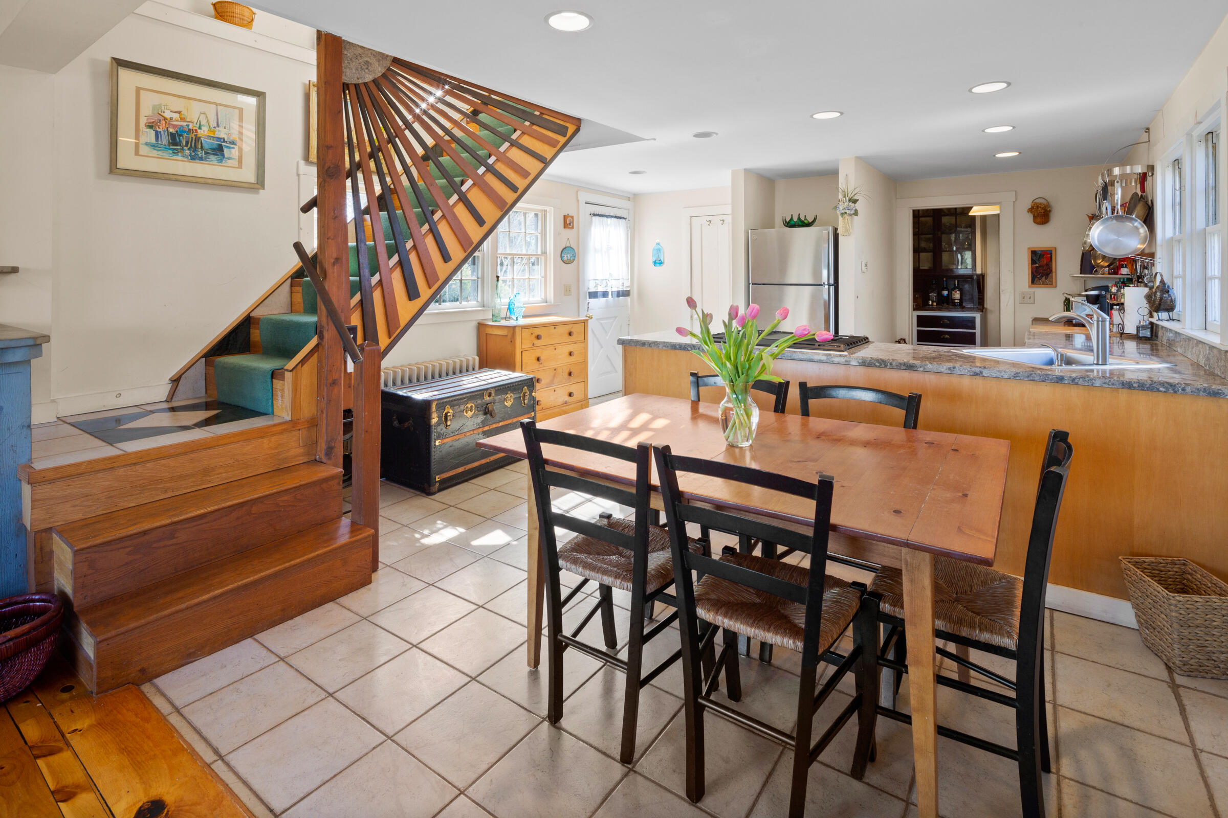 115 Commercial Street, Unit B Wellfleet, MA 02667 - Photo 9 of 37 a view of a dining room with furniture