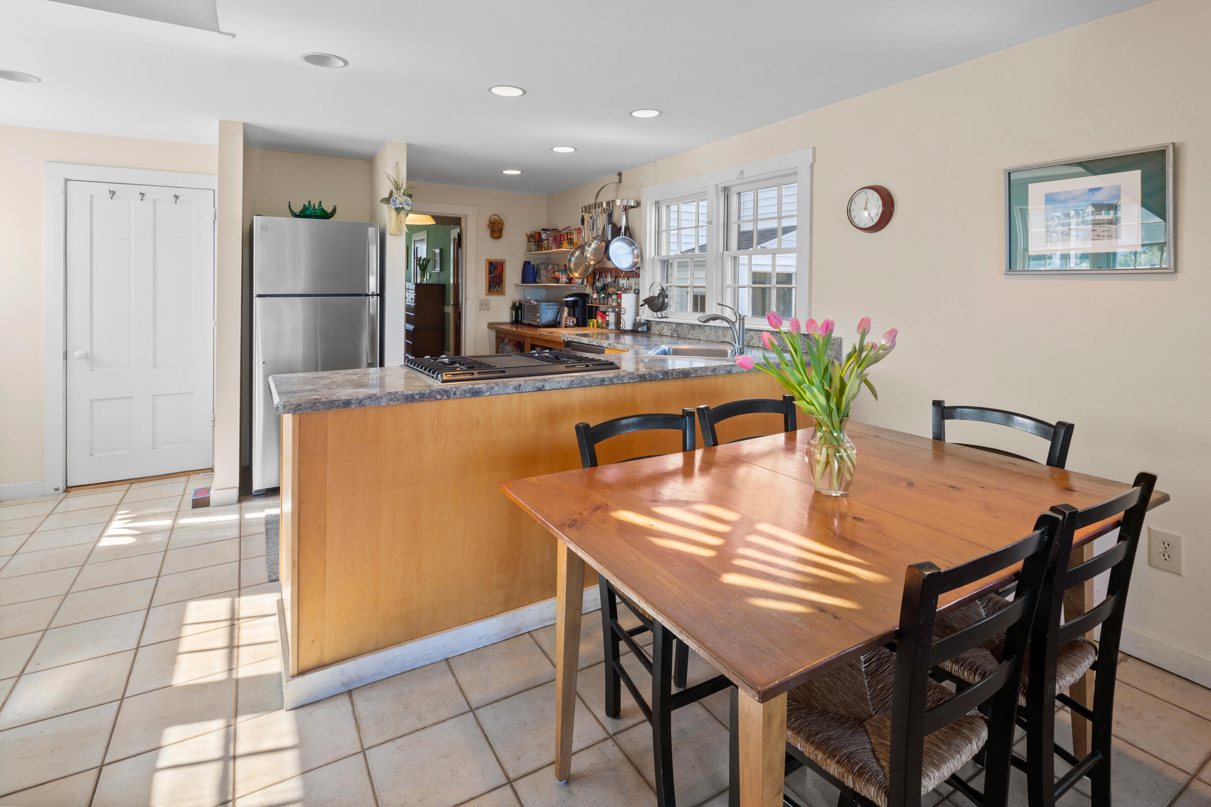 115 Commercial Street, Unit B Wellfleet, MA 02667 - Photo 10 of 37 a dining room with furniture and window