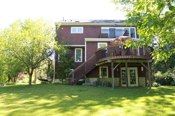 36 Alpine Road Wayland, MA 01778 - Photo 10 of 13 a front view of a house with a garden