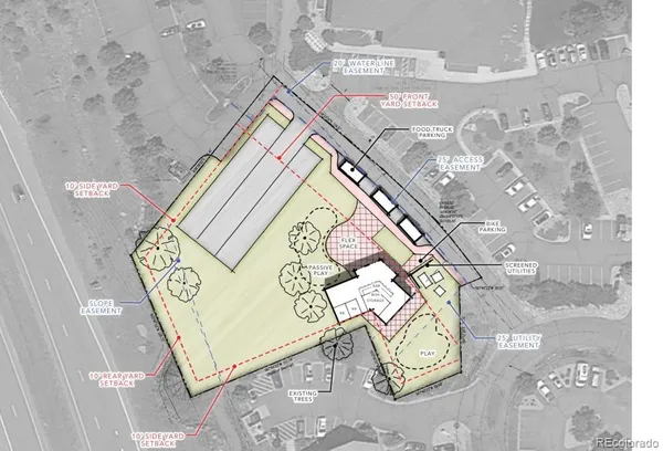 an aerial view of a residential apartment building with a garage