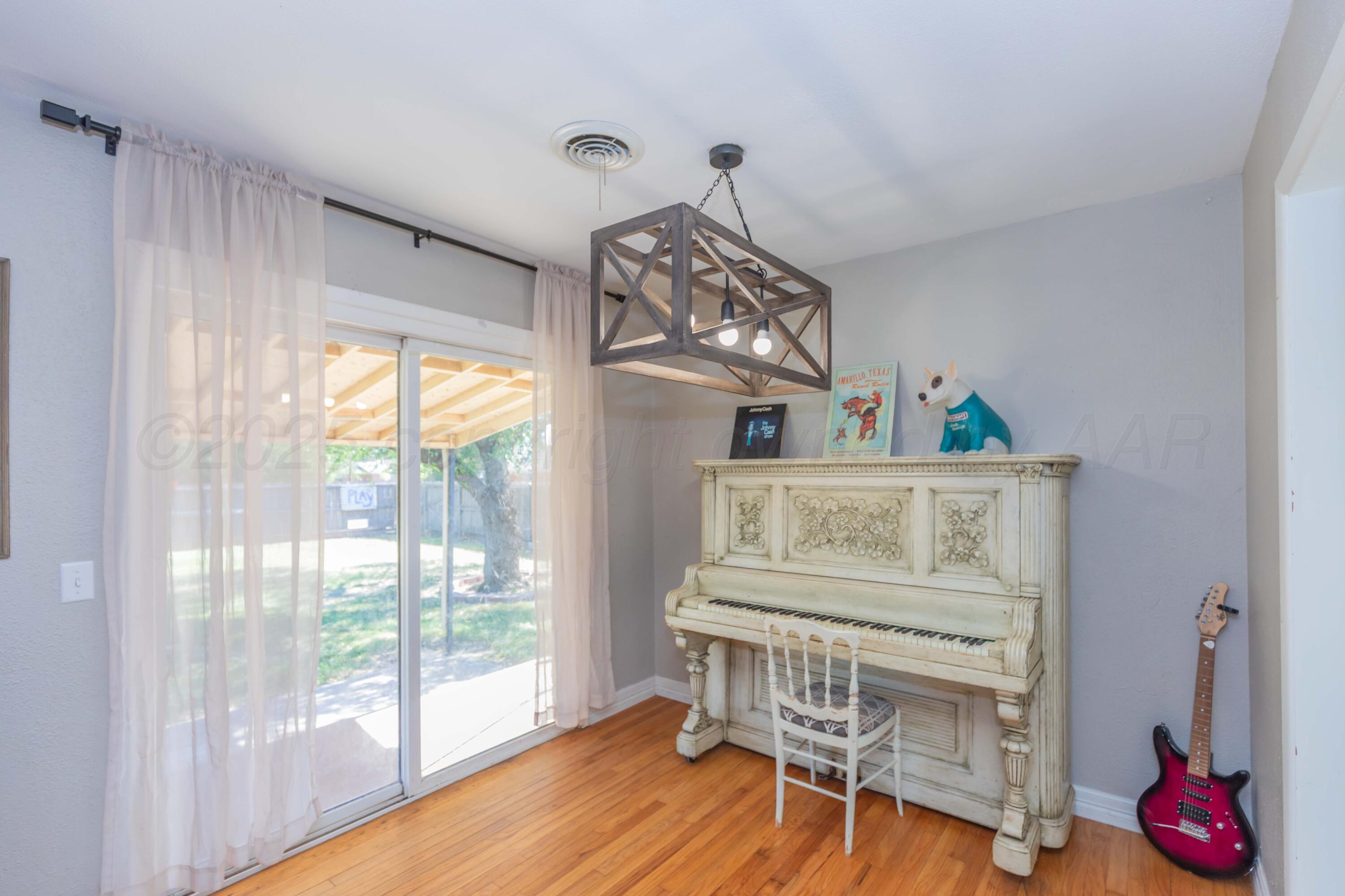 315 Pratt Street Claude, TX 79019 - Photo 13 of 38 a view of a room with wooden floor fan and windows