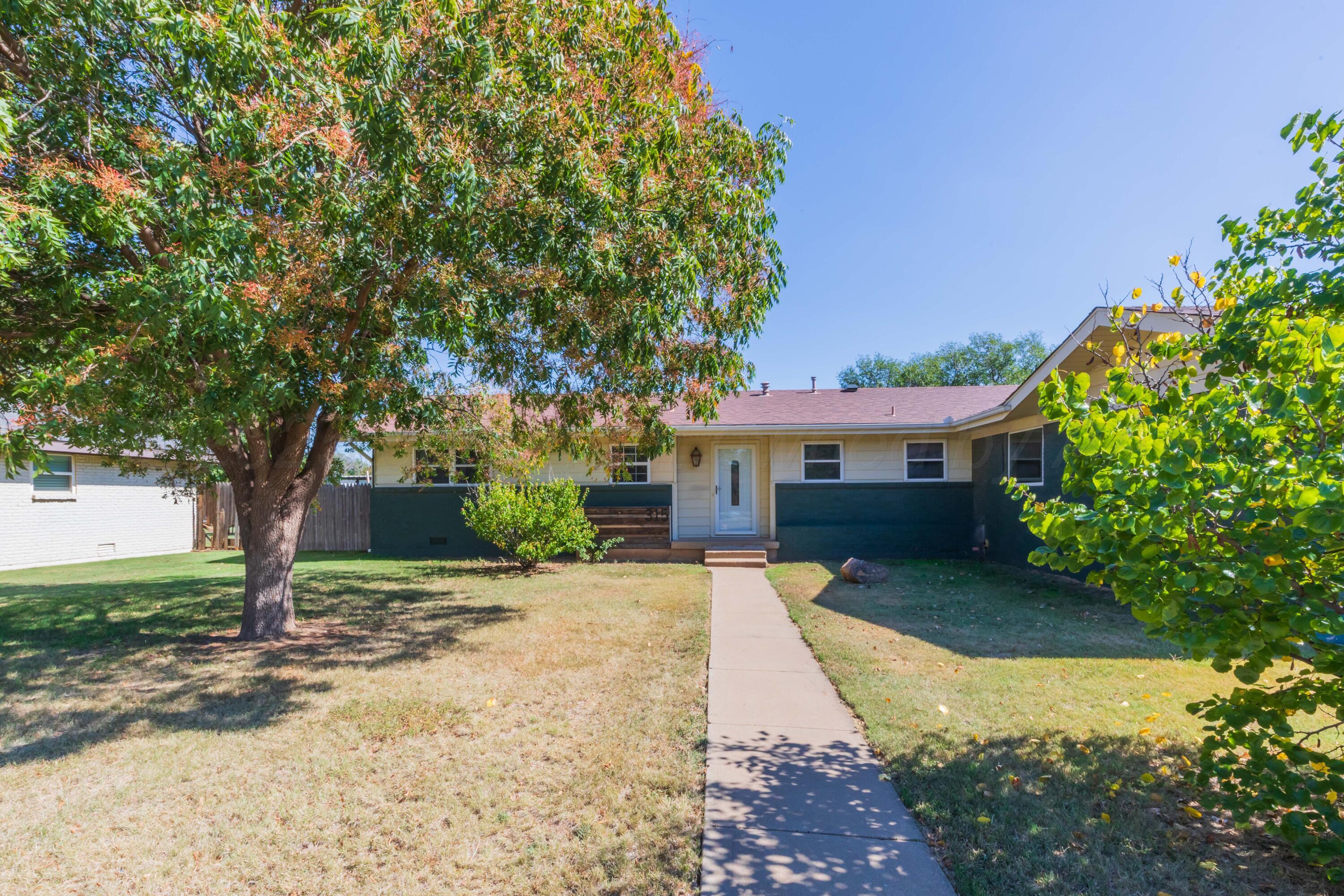 315 Pratt Street Claude, TX 79019 - Photo 2 of 38 a front view of a house with a garden
