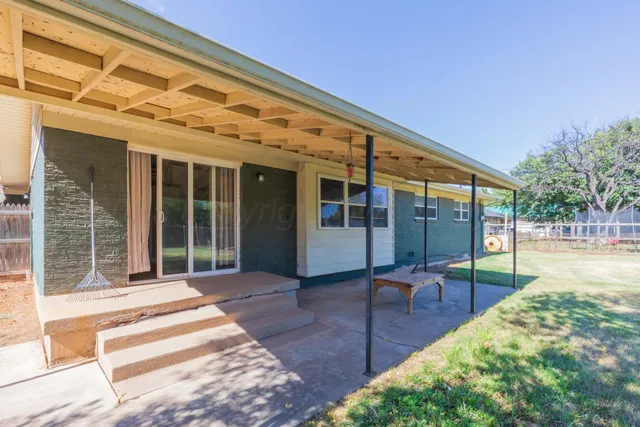 a view of a patio with table and chairs and wooden floor