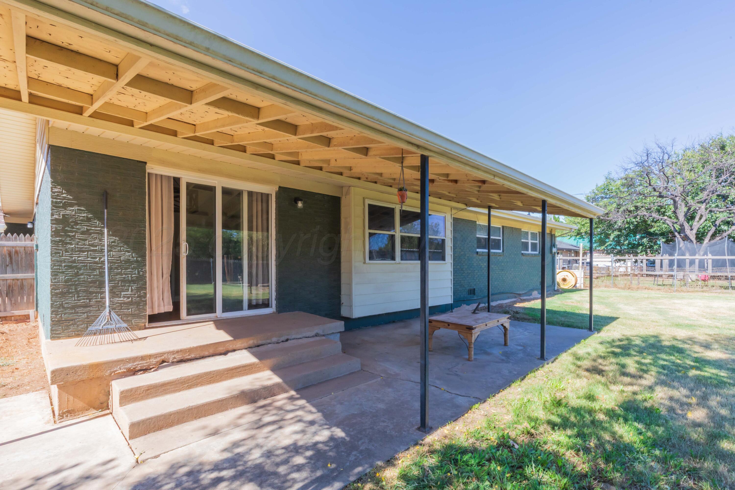 315 Pratt Street Claude, TX 79019 - Photo 34 of 38 a view of a patio with table and chairs and wooden floor