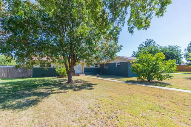 a house with trees in front of it