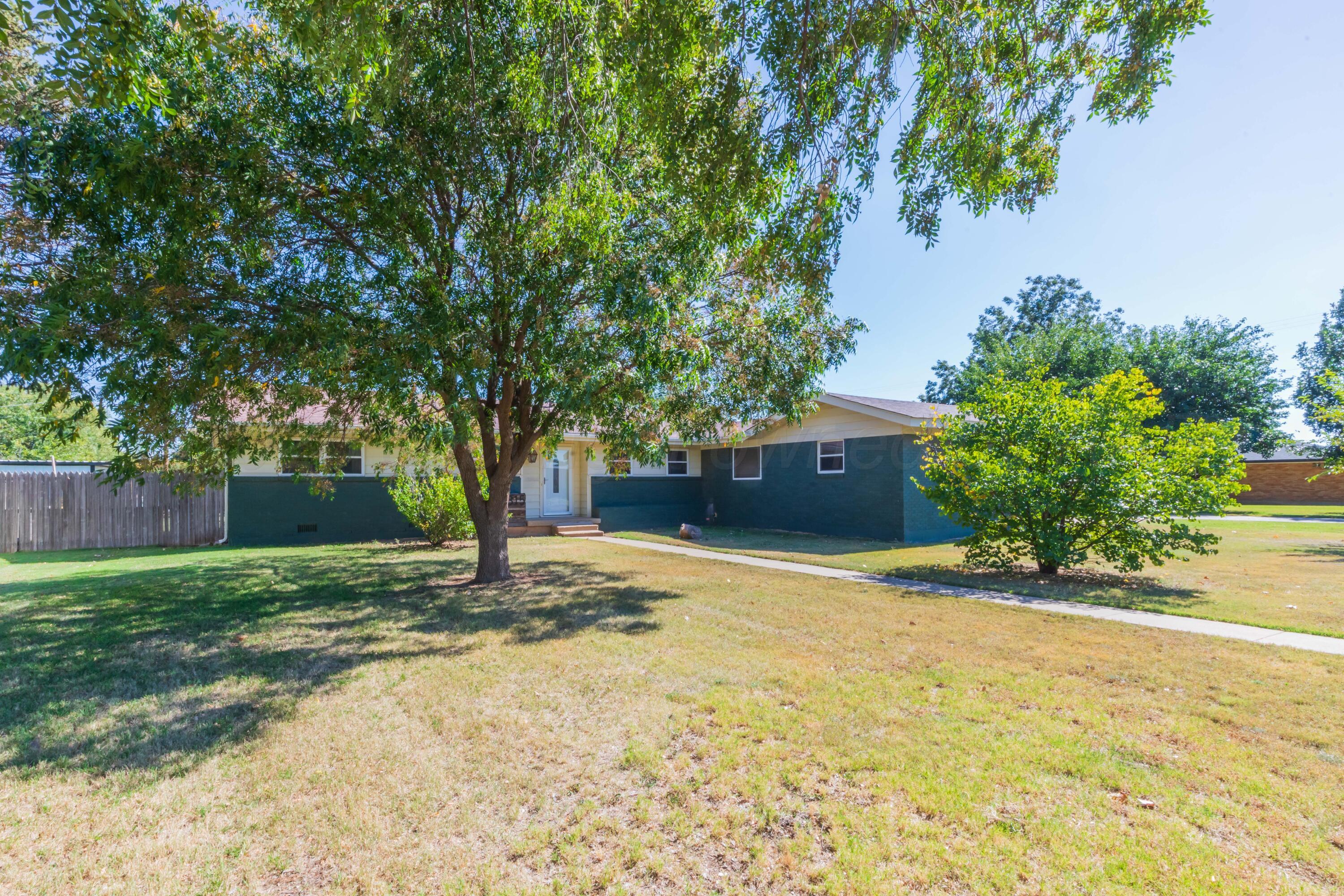 315 Pratt Street Claude, TX 79019 - Photo 4 of 38 a house with trees in front of it