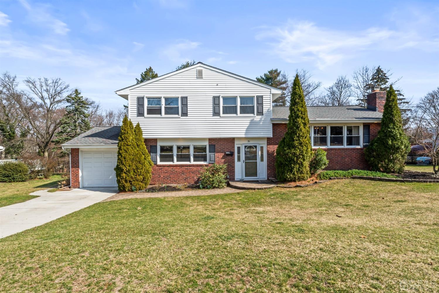 51 Agate Road East Brunswick, NJ 08816 - Photo 1 of 27 a front view of a house with a yard