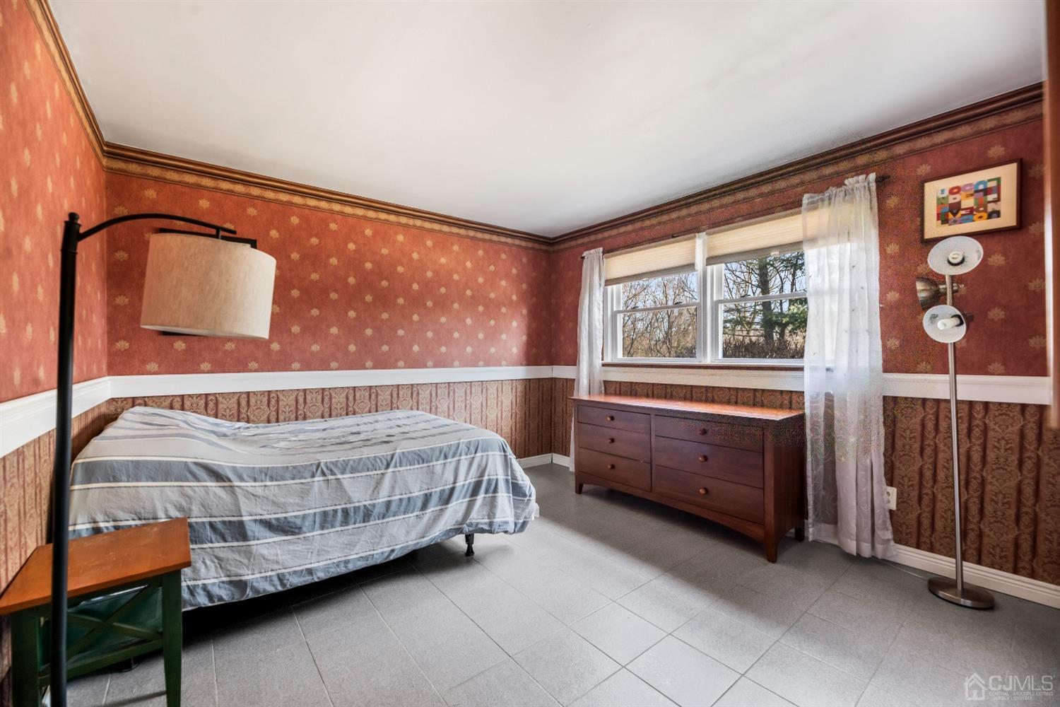 51 Agate Road East Brunswick, NJ 08816 - Photo 5 of 27 a bedroom with a bed and a window