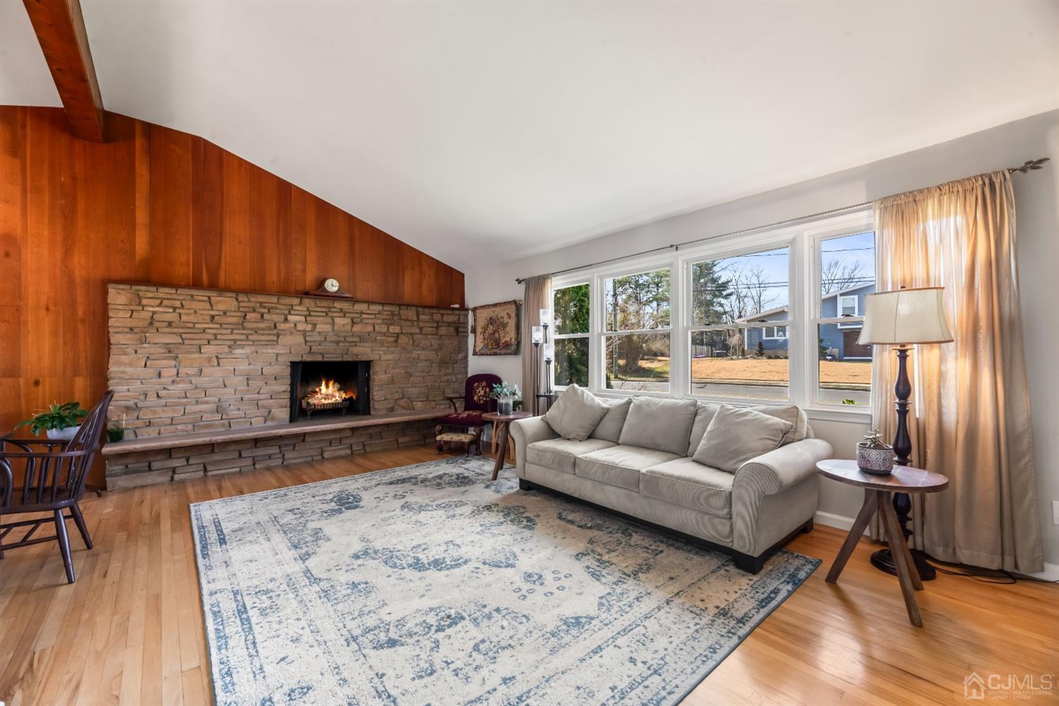 51 Agate Road East Brunswick, NJ 08816 - Photo 7 of 27 a living room with furniture and a fireplace