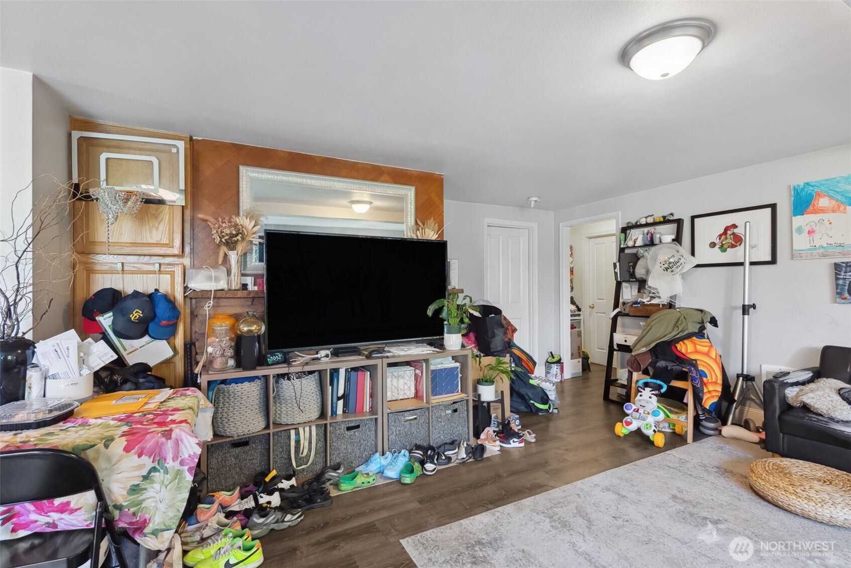 1306 South Bayview Street Seattle, WA 98144 - Photo 11 of 13 a room with furniture and a flat screen tv