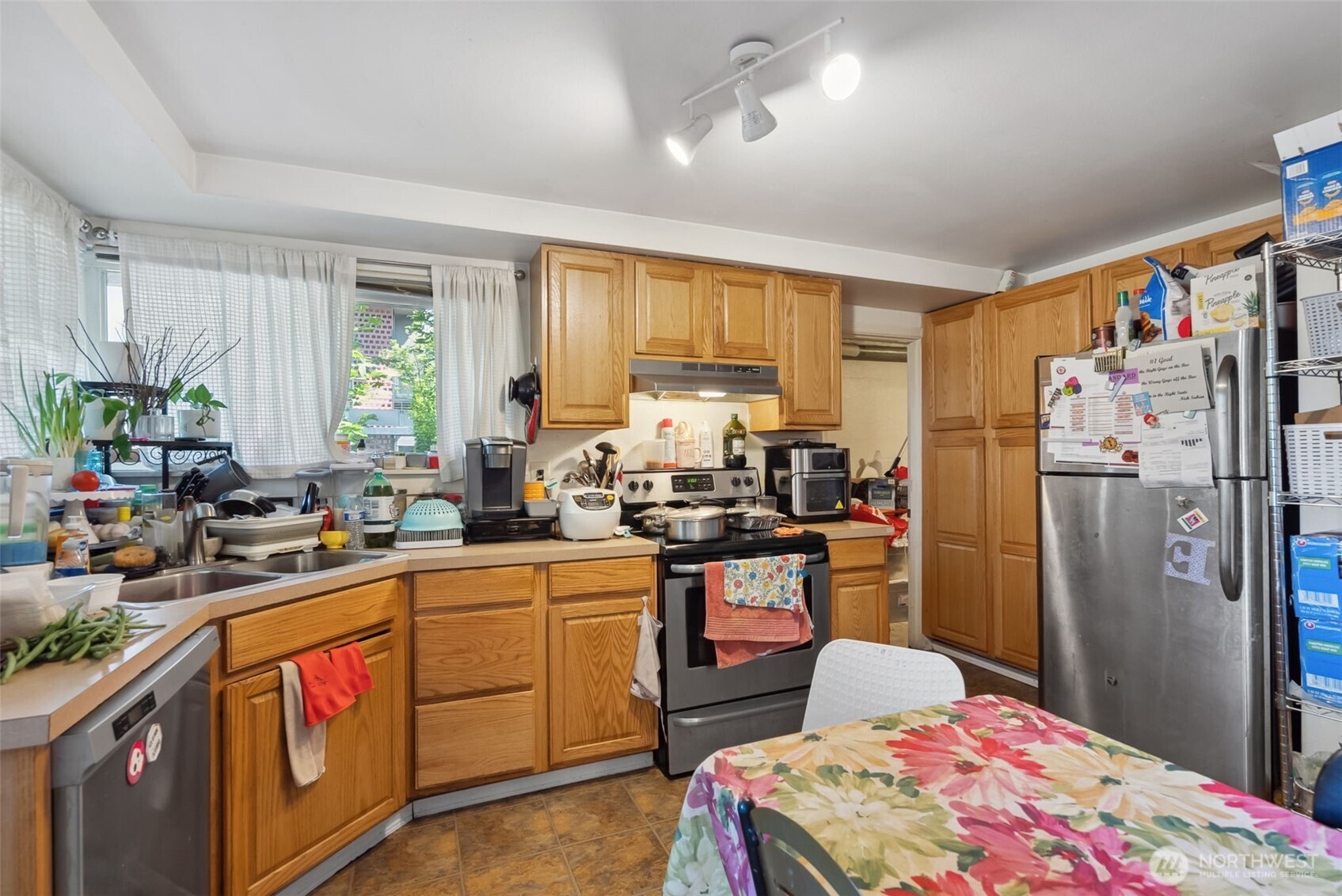 1306 South Bayview Street Seattle, WA 98144 - Photo 13 of 13 a kitchen with sink refrigerator and window