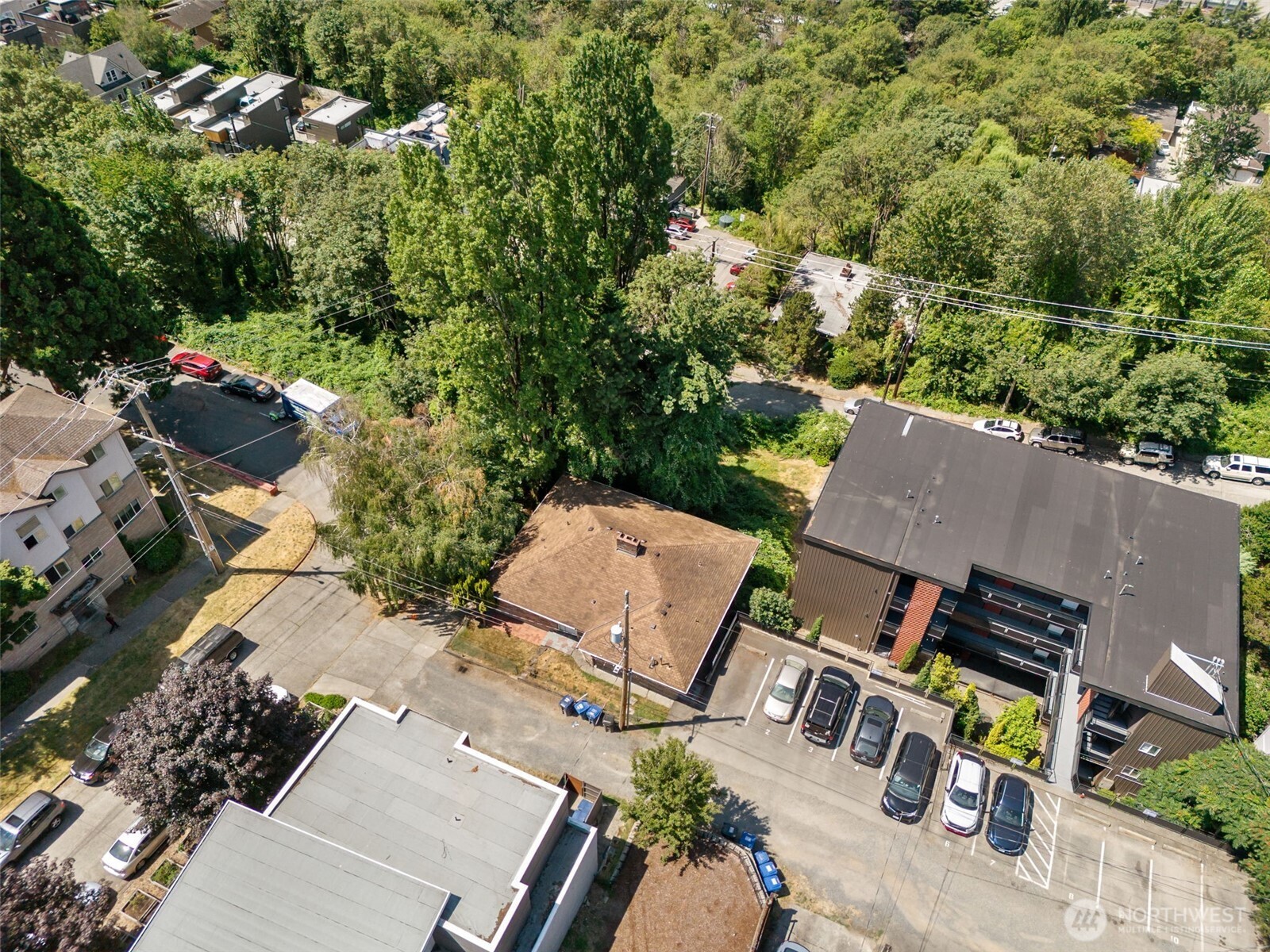 1306 South Bayview Street Seattle, WA 98144 - Photo 2 of 13 an aerial view of a house with a yard and street
