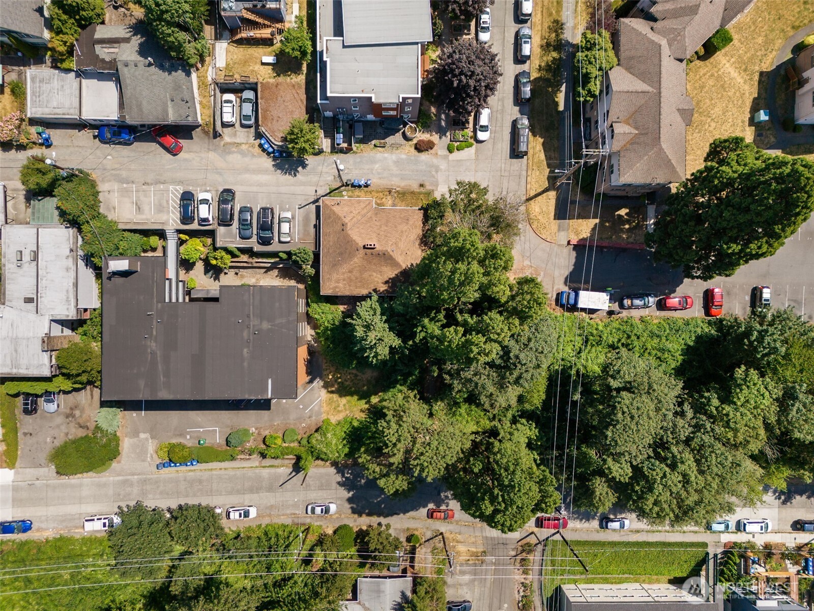 1306 South Bayview Street Seattle, WA 98144 - Photo 3 of 13 an aerial view of a house with a yard basket ball court and outdoor seating
