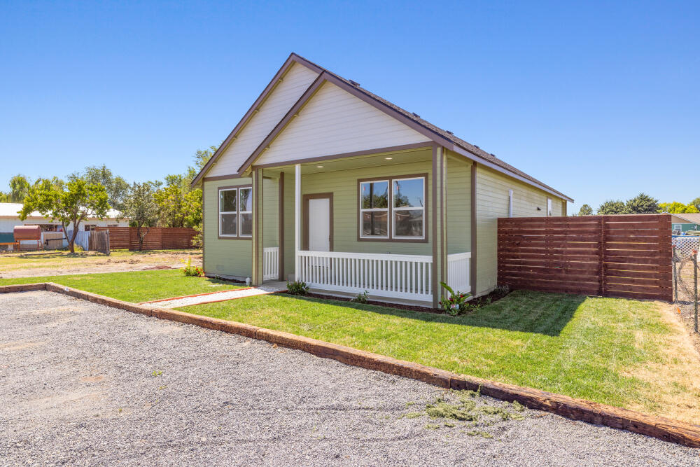 330 North Elm Street Merrill, OR 97633 - Photo 2 of 23 a view of backyard with a garden and deck