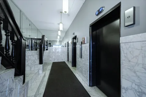 a hallway and a painting on the wall