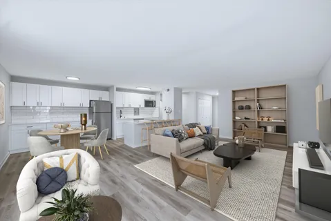 a living room with furniture and view of kitchen