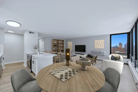 a living room with furniture a rug and a flat screen tv