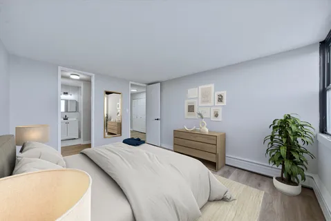 a bedroom with a bed and a couch