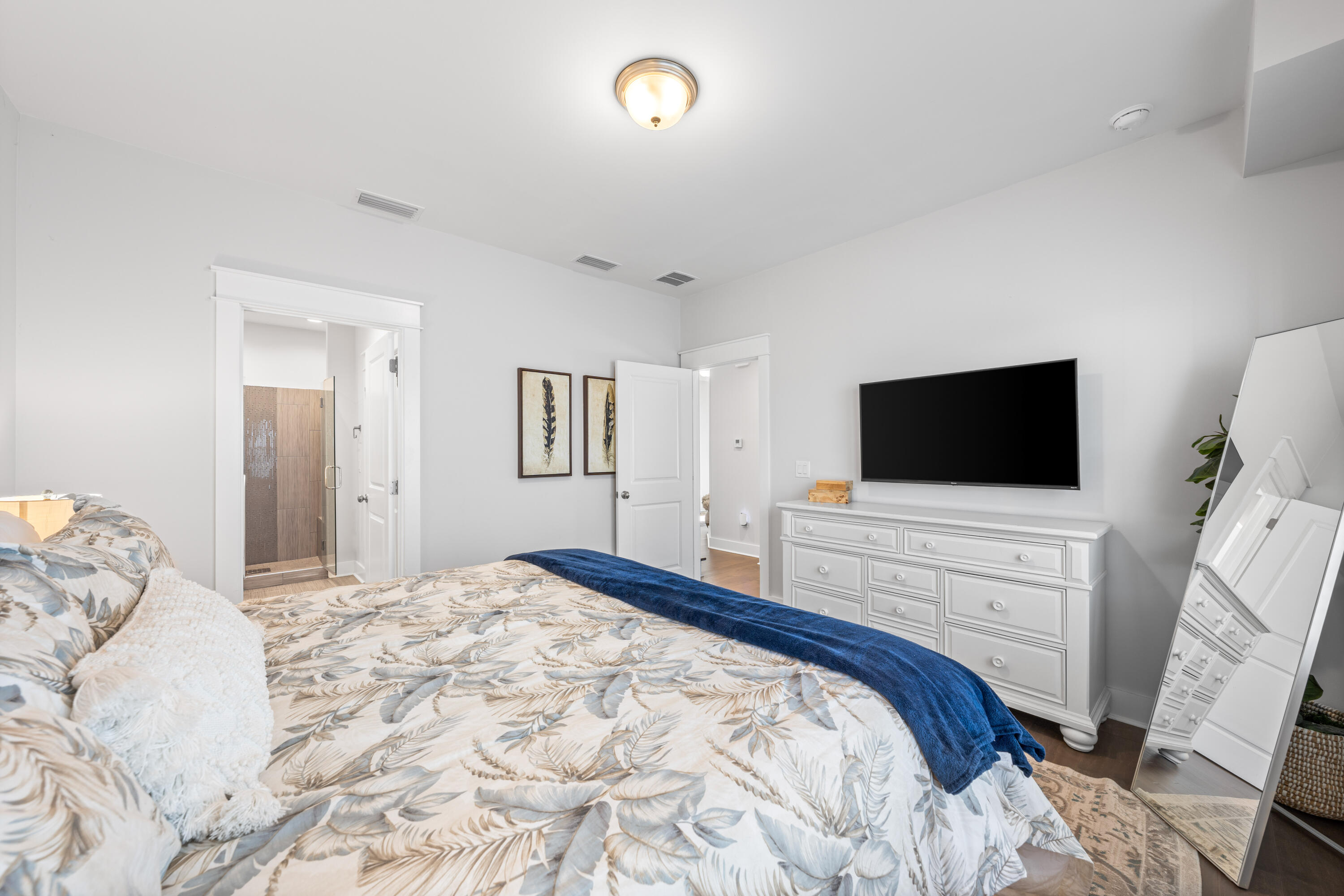 222 Valdare Ln Inlet Beach Inlet Beach, FL 32461 - Photo 21 of 39 a bedroom with a bed and a flat screen tv