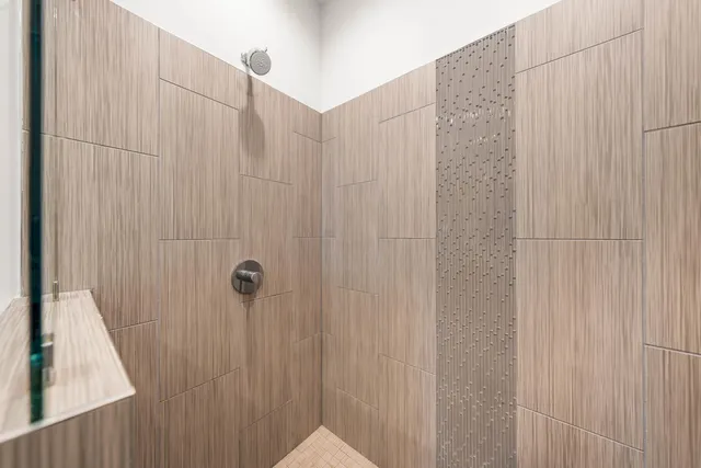 a view of entryway bedroom and hall with wooden floor