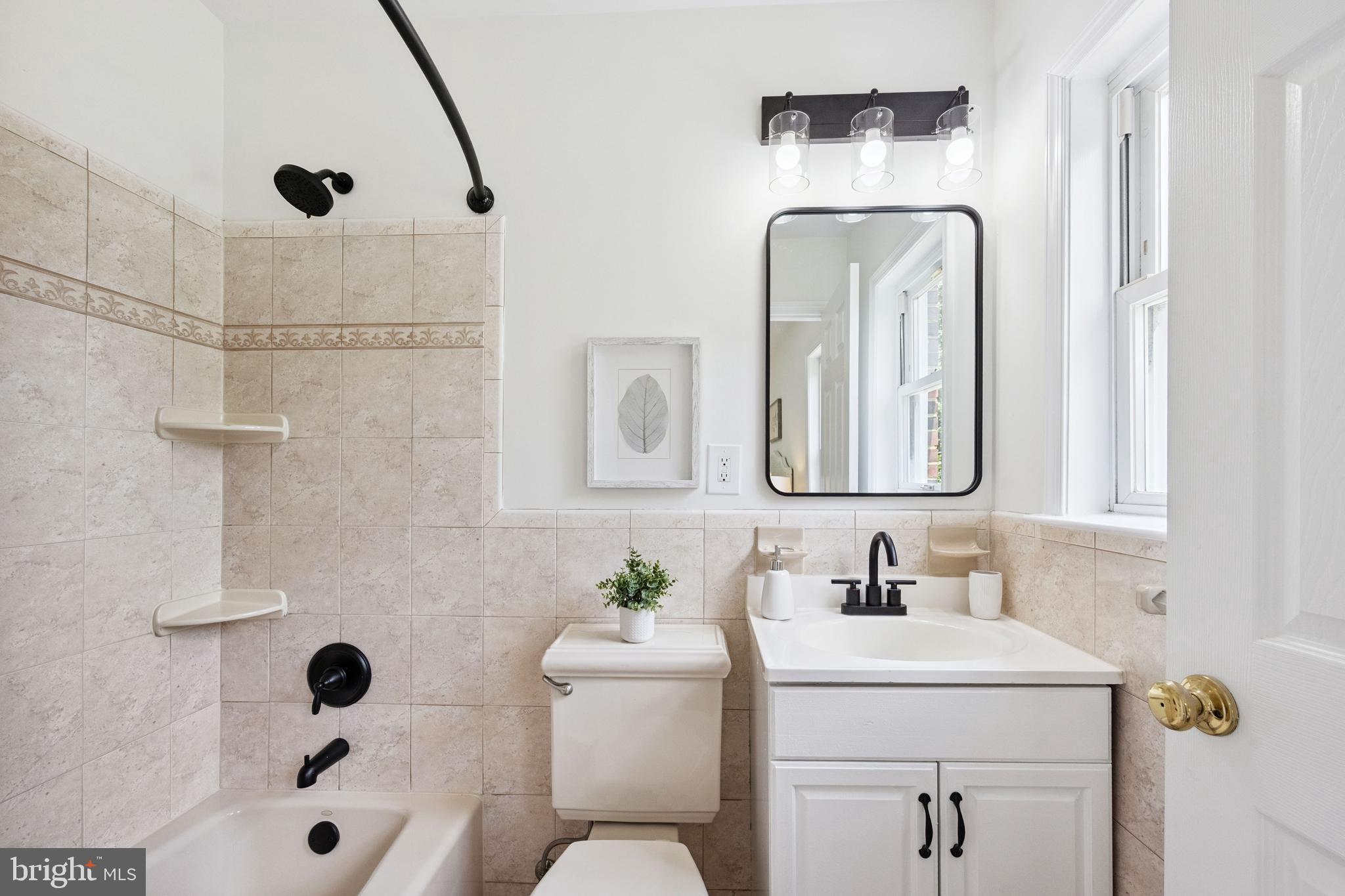 7035 Calamo Street Springfield, VA 22150 - Photo 22 of 39 Updated Primary ensuite Ceramic Bath w/Granite