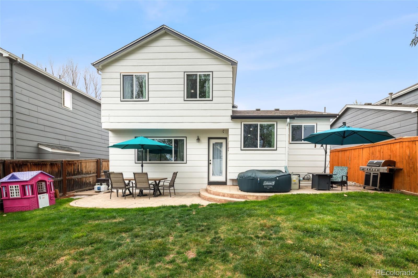 9677 South Castle Ridge Circle Highlands Ranch, CO 80129 - Photo 24 of 24 a front view of house with yard and outdoor seating
