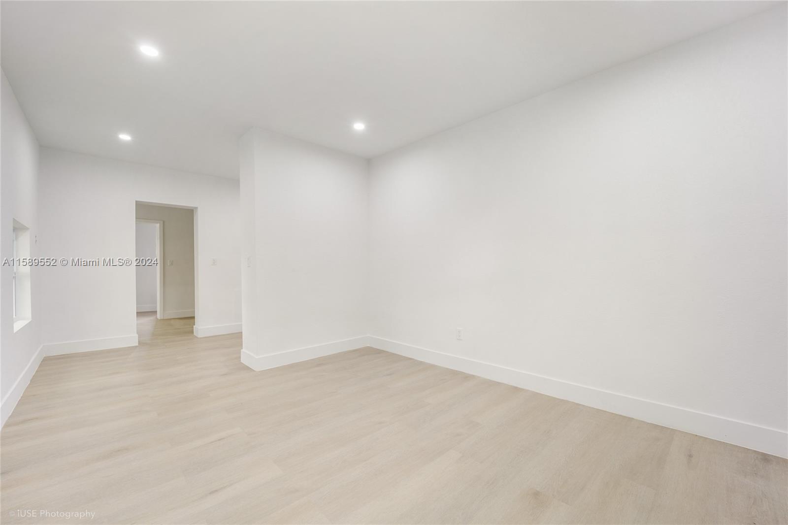 2130 Northwest 28th Street Miami, FL 33142 - Photo 14 of 48 an empty room with an entryway