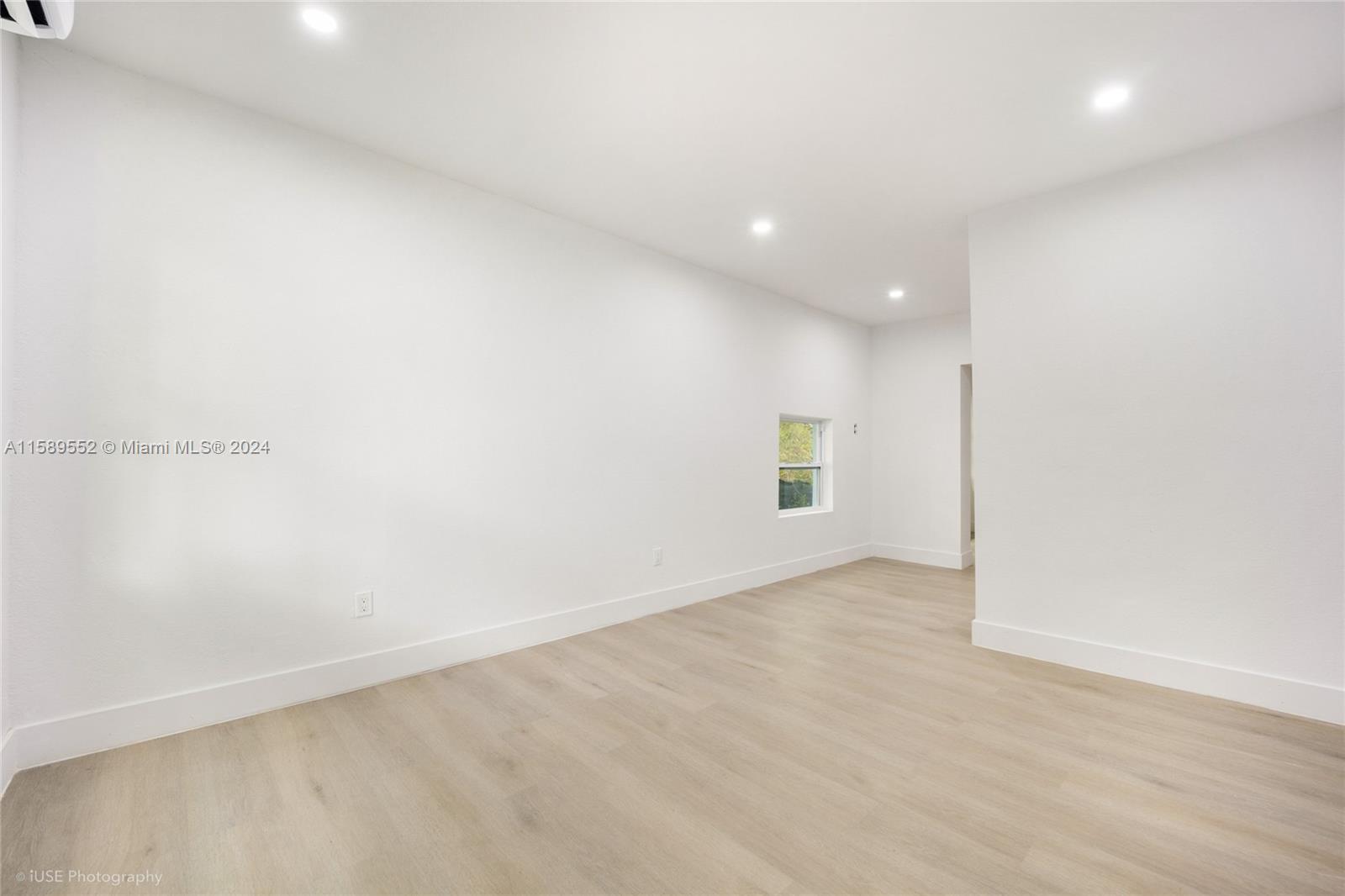 2130 Northwest 28th Street Miami, FL 33142 - Photo 15 of 48 an empty room with a empty space and window