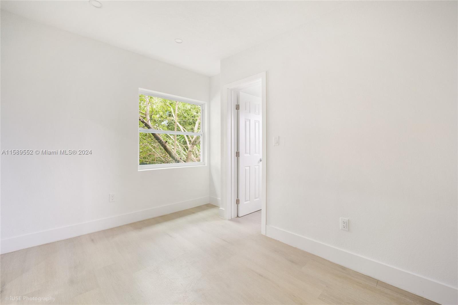 2130 Northwest 28th Street Miami, FL 33142 - Photo 20 of 48 an empty room with windows