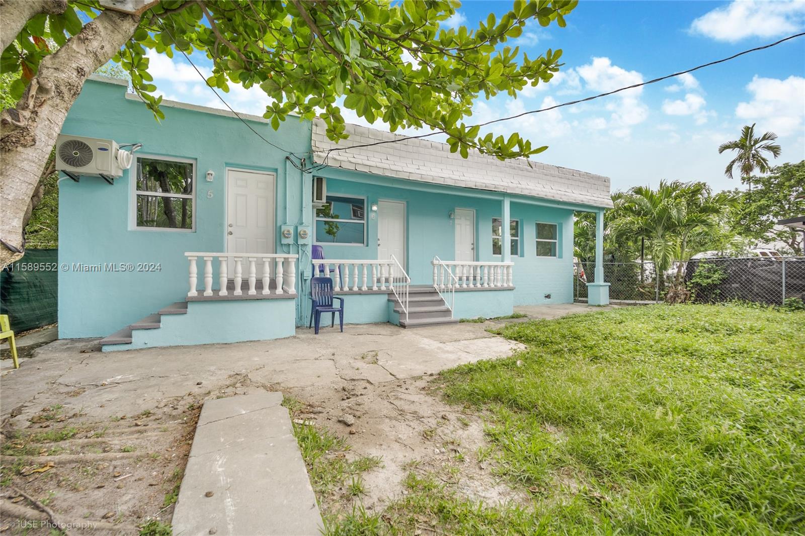 2130 Northwest 28th Street Miami, FL 33142 - Photo 24 of 48 a front view of a house with a yard