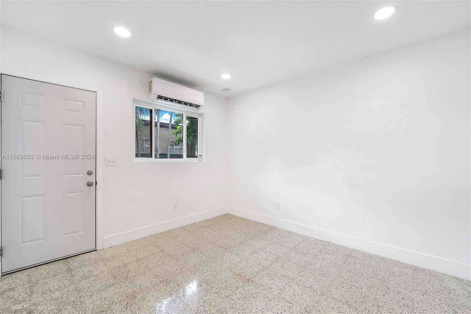 2130 Northwest 28th Street Miami, FL 33142 - Photo 29 of 48 an empty room with windows