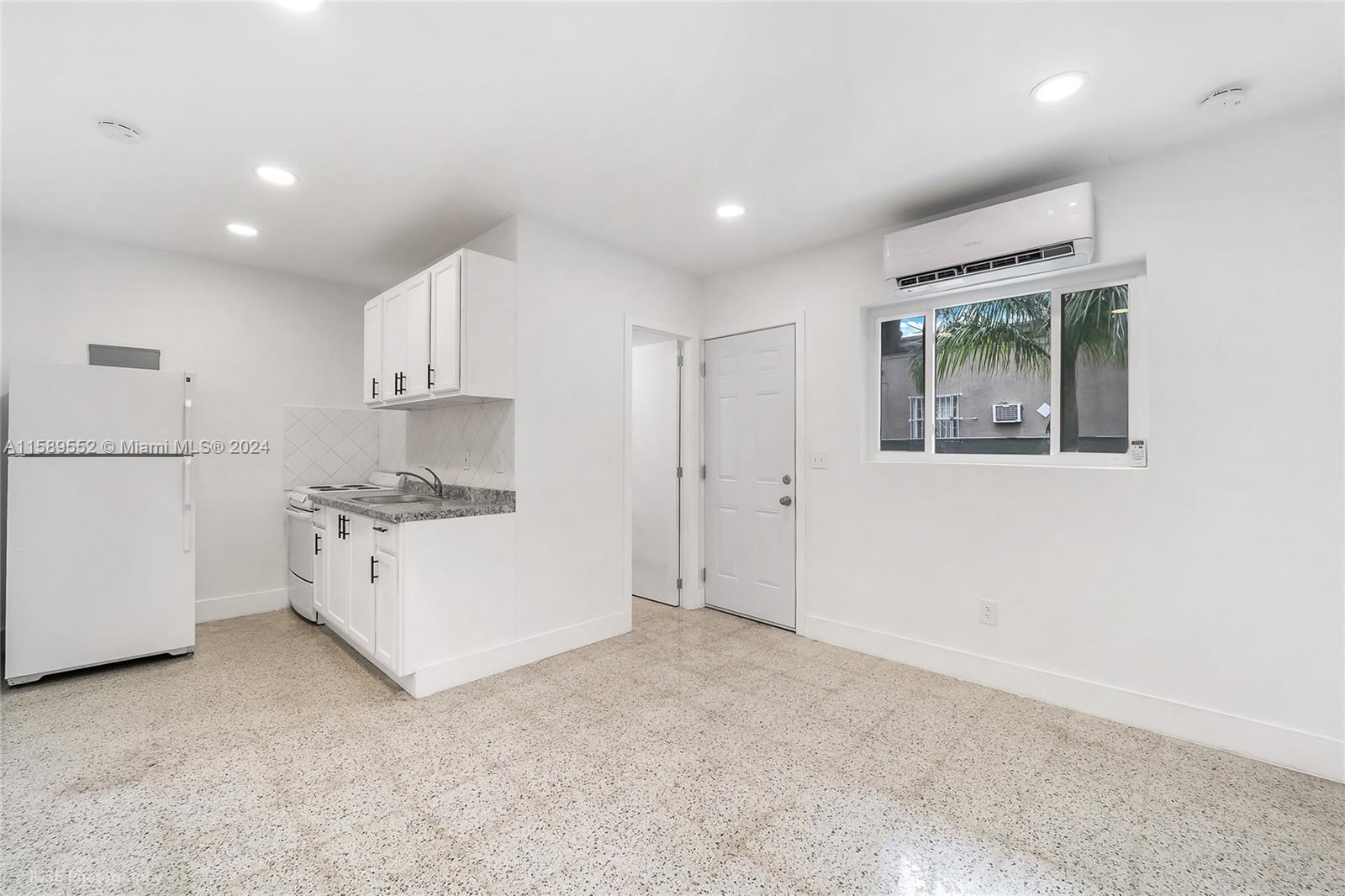 2130 Northwest 28th Street Miami, FL 33142 - Photo 30 of 48 a room with furniture and a window