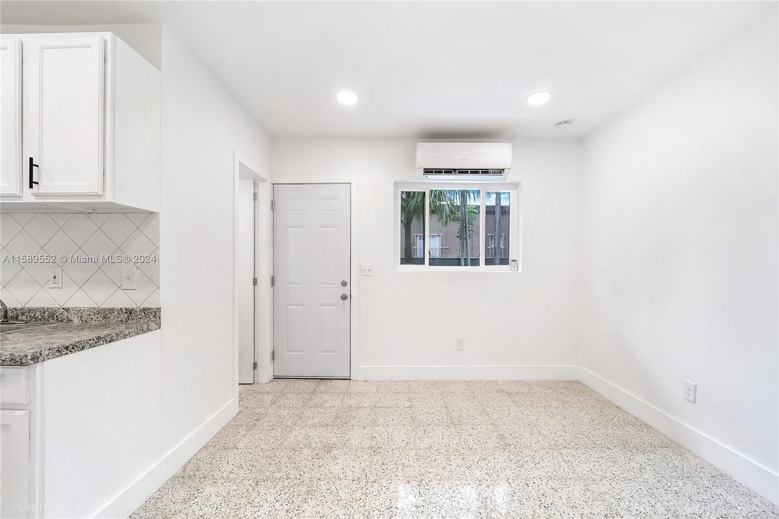 2130 Northwest 28th Street Miami, FL 33142 - Photo 35 of 48 an empty room with windows