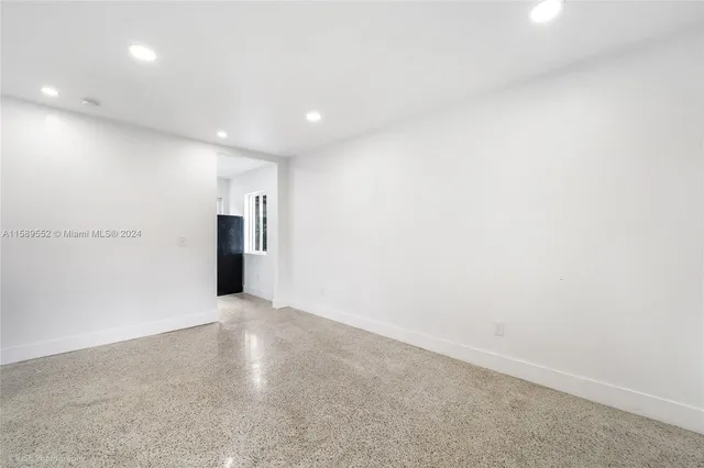 en empty room with windows and closet